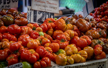 Rouge de Marmande tomato display at a farmers' market.