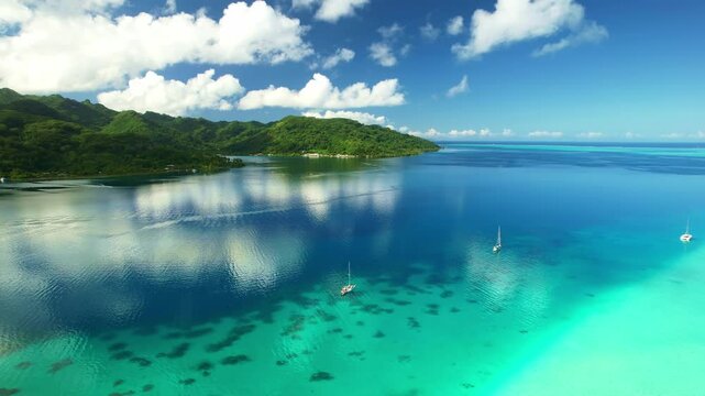 Drone Tahiti. Aerial view of Tahaa island coastline, lagoon and clear ocean water in French Polynesia. Exotic travel vacation getaway, famous tourism romantic honeymoon destination. 