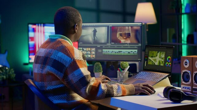 Video maker producing footage with artistic editing software, doing color adjustment and special effects. Digital videographer illustrator developing transitions for cinematic production. Camera A.