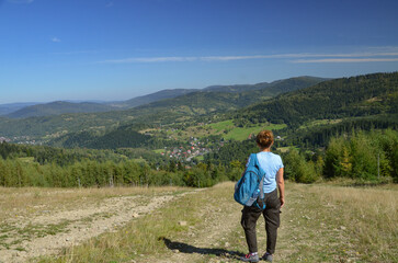 Naklejka premium Backpacker on the trail from Korbielów to Pilsko