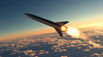 Fototapeta premium A black missile with bright orange fire blasts off into the sunset sky above white puffy clouds.