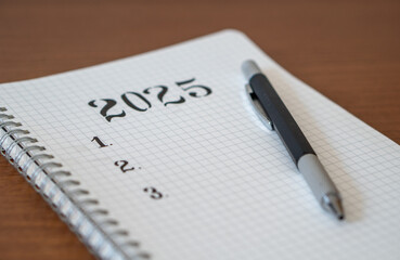 Notebook with 2025 Goals for New Year Resolutions