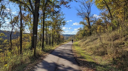 Fototapeta premium A day off spent biking through a scenic trail, with fresh air and beautiful views all around. This day combines relaxation and fitness