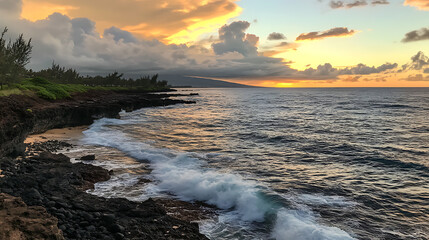 Waves gently crashing against the rocky shoreline under a dramatic sunset with colorful clouds 