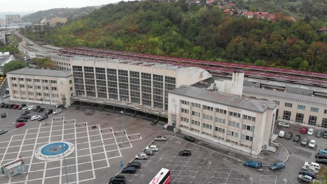Aerial: Saravejo train station in Bosnia and Hercegovina. Going down
