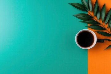 A vibrant flat lay featuring a coffee cup on teal and orange backgrounds, accompanied by green leaves for a refreshing aesthetic.