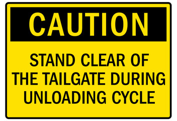 Truck safety signs stand clear of the tailgate during unloading cycle