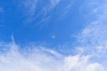beautiful blue sky and white fluffy group of clouds with sunrise in the morning, natural background