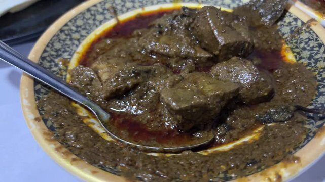 Mutton liver curry served in a Mughal restaurant in India