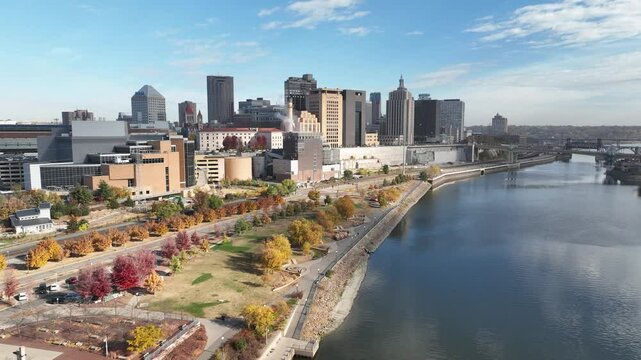 Aerial view of St. Paul Minnesota's downtown skyline along the Mississippi River with vibrant fall colors