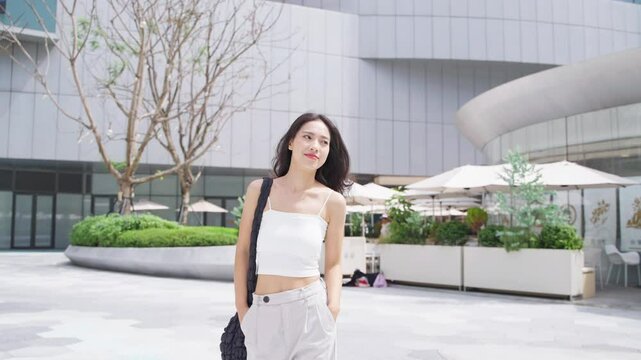young woman with shopping bags in the city