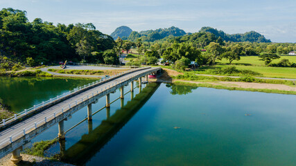 Aerial drone view of a bridge by a river at Kampung Wai, Perlis, Malaysia