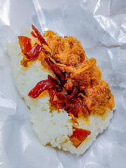 Thai food is "khao niew moo tod", Sticky rice and deep fried pork.
