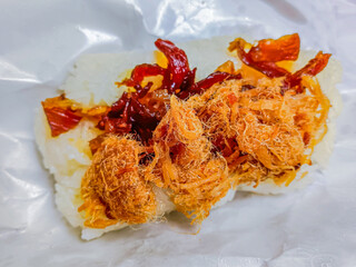 Thai food is "khao niew moo tod", Sticky rice and deep fried pork.