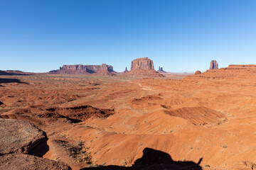 Fototapeta premium Monument Valley Rock Formations, Arizona-Utah Border, USA – Iconic Desert Landscapes with Majestic Buttes and Mesas, Captured in Stunning Light and Natural Splendor