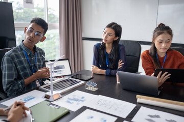 Solar panels green energy Business people working in green eco friendly office business meeting creative ideas for business eco friendly professional teaching corporate people sustainable electricity