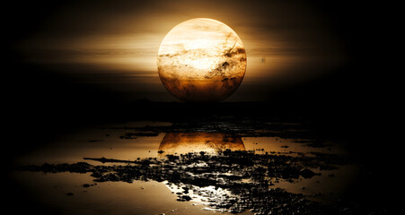 a yellow moon over the water with a full moon behind it