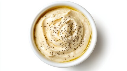 A bowl of creamy tahini sauce with sesame paste, lemon juice, garlic