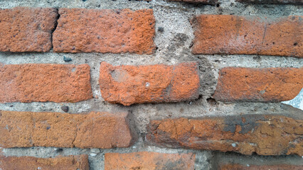 Obraz premium Old brick texture blanks for design Cracked brick. Natural stone texture grouting red stone.