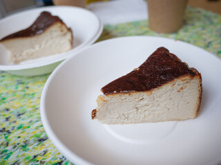 two pieces of vegan cakes on the white plate in cafe of capital kyiv