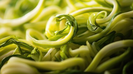 Crisp puntarelle lettuce, showcasing vibrant green leaves twisted and spiraled, highlighting the unique texture and flavor of this traditional Italian salad.