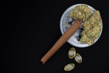 Medical cannabis buds are dried flowers of cannabis plants, rich in cannabinoids like THC and CBD, used therapeutically for various health condition against black background