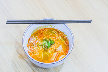 Ramen with chopsticks on the table, Japanese style noodle soup, Chuka soba or shina soba