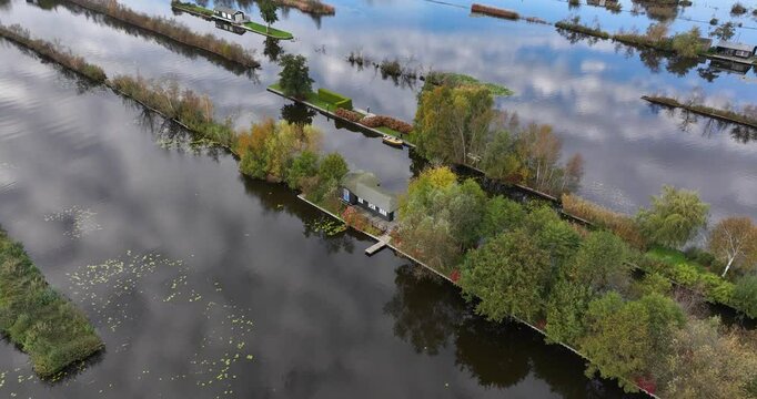 small houses at the Loosdrechtse Plassen, Scheendijk, marina of Breukelen, The Netherlands, nature reserve with tow holes and legakkers