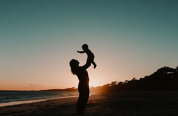 mother joyfully lifts her baby in air at sunset on serene beach, creating heartwarming silhouette against colorful sky