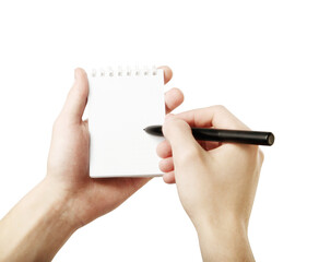 Hands holding a small spiral notebook with a pen, ready to write on a white background. Concept of...