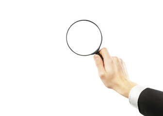 A hand holding a magnifying glass in close-up, isolated on a clean white background. Useful for...