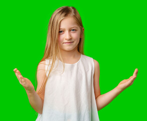 A young girl showcases an inviting gesture with open palms against a bright green backdrop