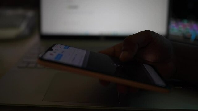 A persone using a smartphone by hand