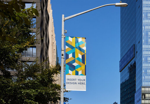 Bright Yellow Pole Banner on a Street Light in New York Under Clear Blue Sky. PSD Mockup Template