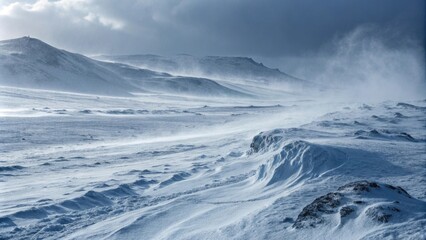 Windswept snowy landscape under dramatic skies