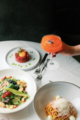 Authentic Dining Moments: Culinary Delights, Drinks, and Atmosphere in a Vibrant Restaurant Setting