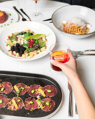 Authentic Dining Moments: Culinary Delights, Drinks, and Atmosphere in a Vibrant Restaurant Setting
