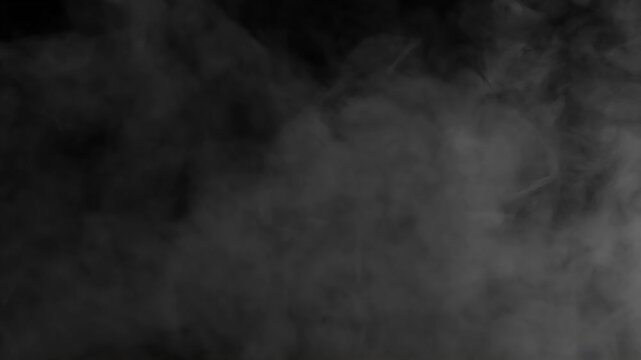 White Smoke is Slowly Moving. Gray smoke on a black background slowly dissipates and disappears from the screen