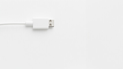Minimalist white USB cable on a plain background for technology use