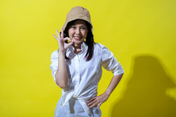 Asian woman smiling confidently, making an 