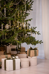 A Christmas tree with a lot of ornaments and lights