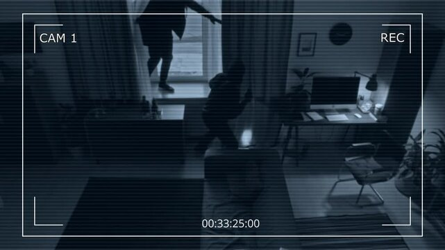 CCTV shot of two thieves with crowbar and flashlight breaking into apartment jumping down from windowsill