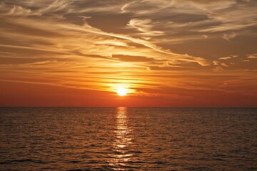 Fototapeta premium Stunning Sunset Landscape with Glowing Warm Light Effects