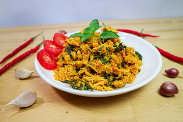 Ayam Suwir Kemangi, Shredded Chicken with Sweet Basil Leaf, Yellow Spices and Sliced Chilli. Traditional Indonesian Food Ayam Woku