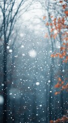 A serene winter scene featuring falling snowflakes amidst blurred trees, evoking a peaceful, chilly atmosphere.
