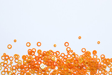 Beautiful orange confetti on a white background