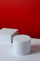 White podiums on color background 