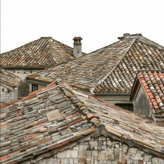Naklejka premium Old terracotta roof tiles covering residential building in europe