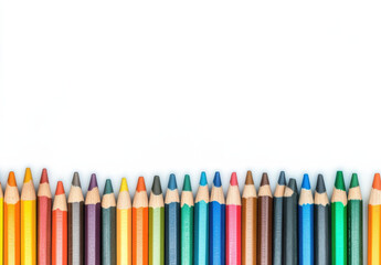 Colorful colored pencils arranged in row on white background, perfect for artistic projects and creativity