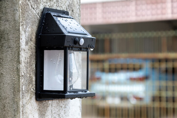 solar powered lights hanging on the fence